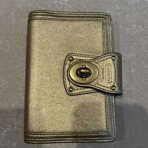 Coach gold daily planner